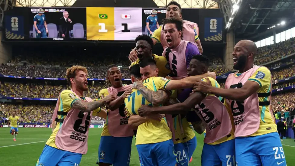 Brazil players celebrate Gabriel Martinelli's stoppage-time winner against Japan in the World Cup Round of 32