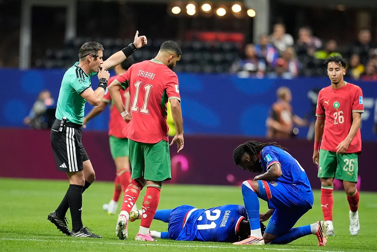 Morocco players celebrate Achraf Hakimi's equalizer against Haiti